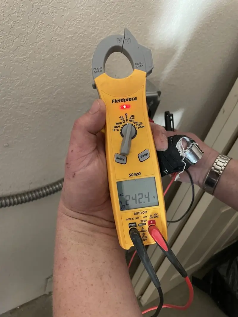 Voltage testing with clamp meter during Electrical Installation Services in Lindsay